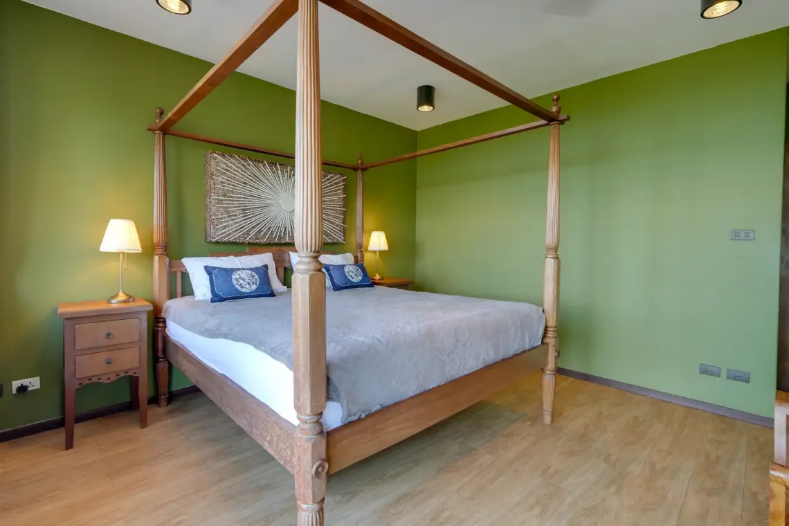 Green bedroom and sitting area at the villa in Taling Ngam, Koh Samui