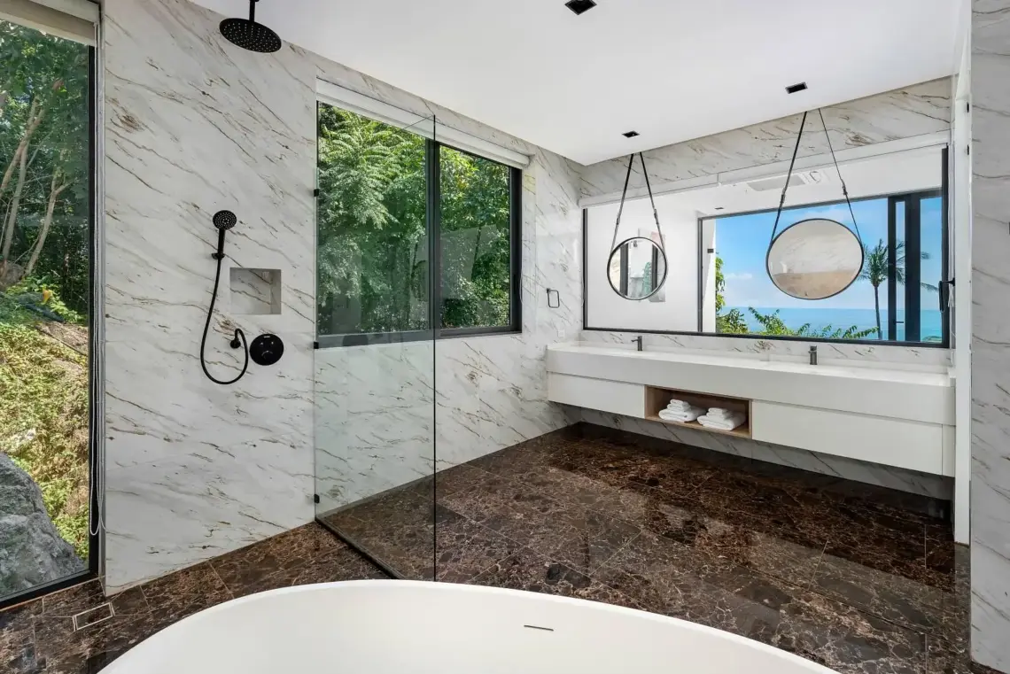 Double vanity and walk-in shower in the granite bathroom of a Chaweng Noi villa