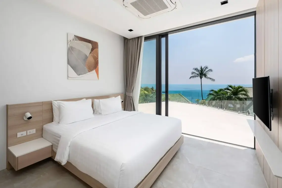 Bedroom with floor-to-ceiling glazing and sea views in Chaweng Noi villa