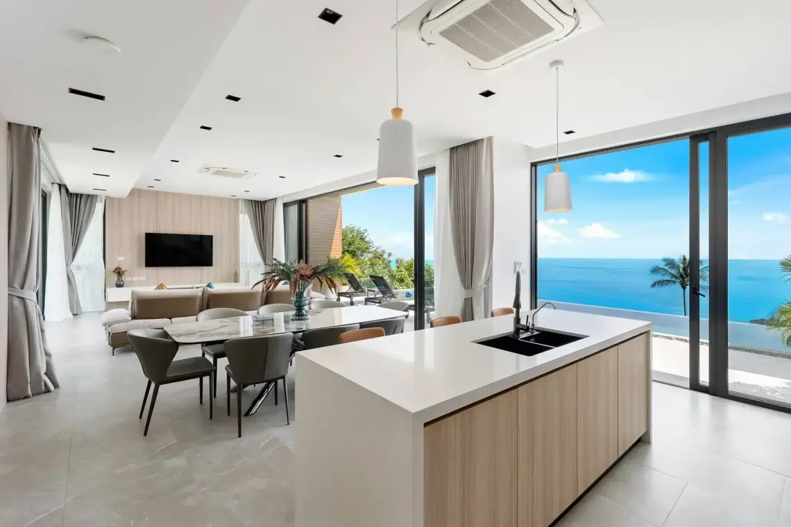 Open-plan kitchen, dining and living area with sea views