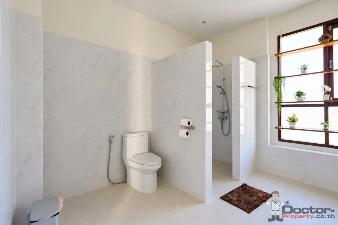 Bathroom shower and toilet at the 4 bedroom pool villa in Plai Laem, Koh Samui