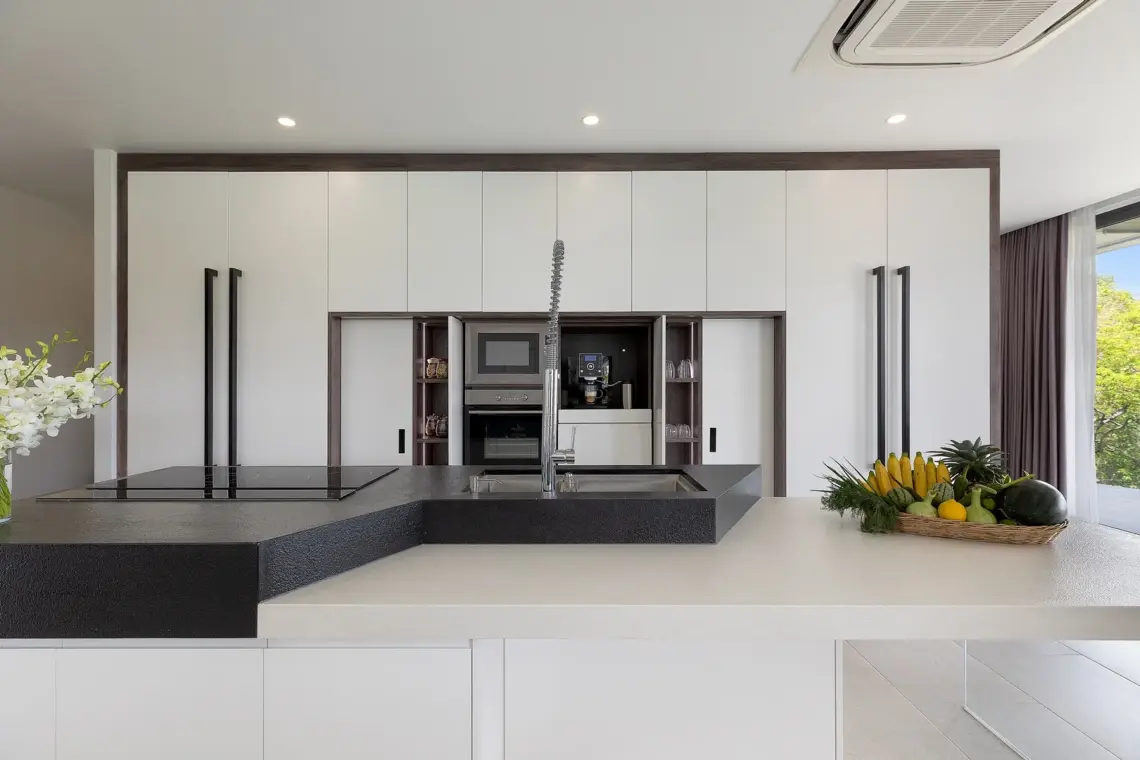 Kitchen with island and fitted cabinetry