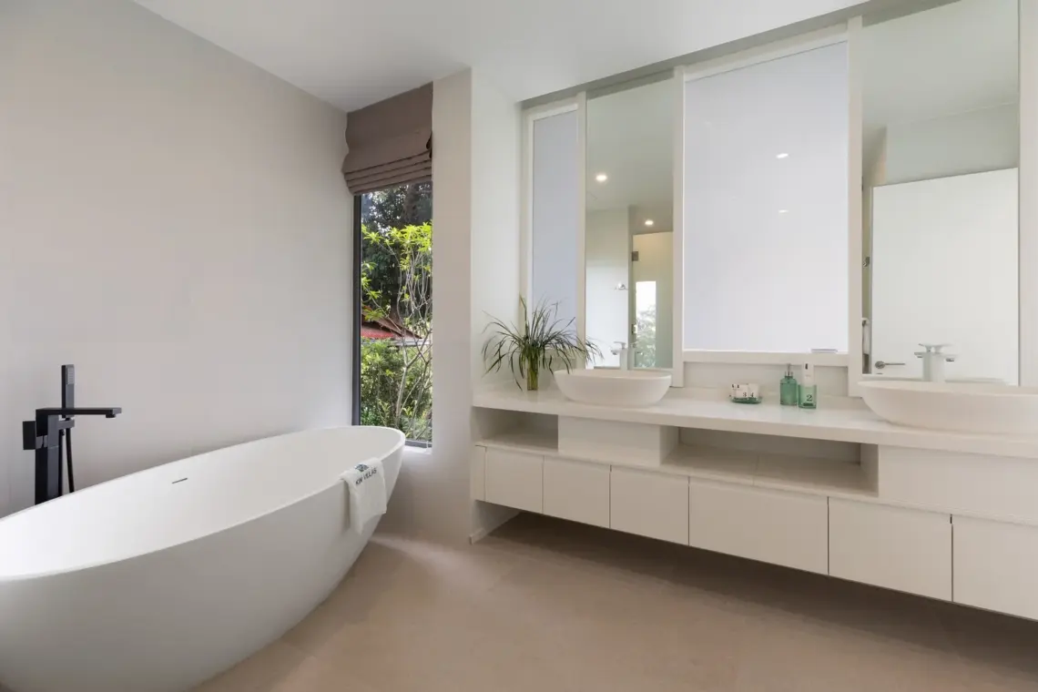 Bathroom with freestanding bath and double basins