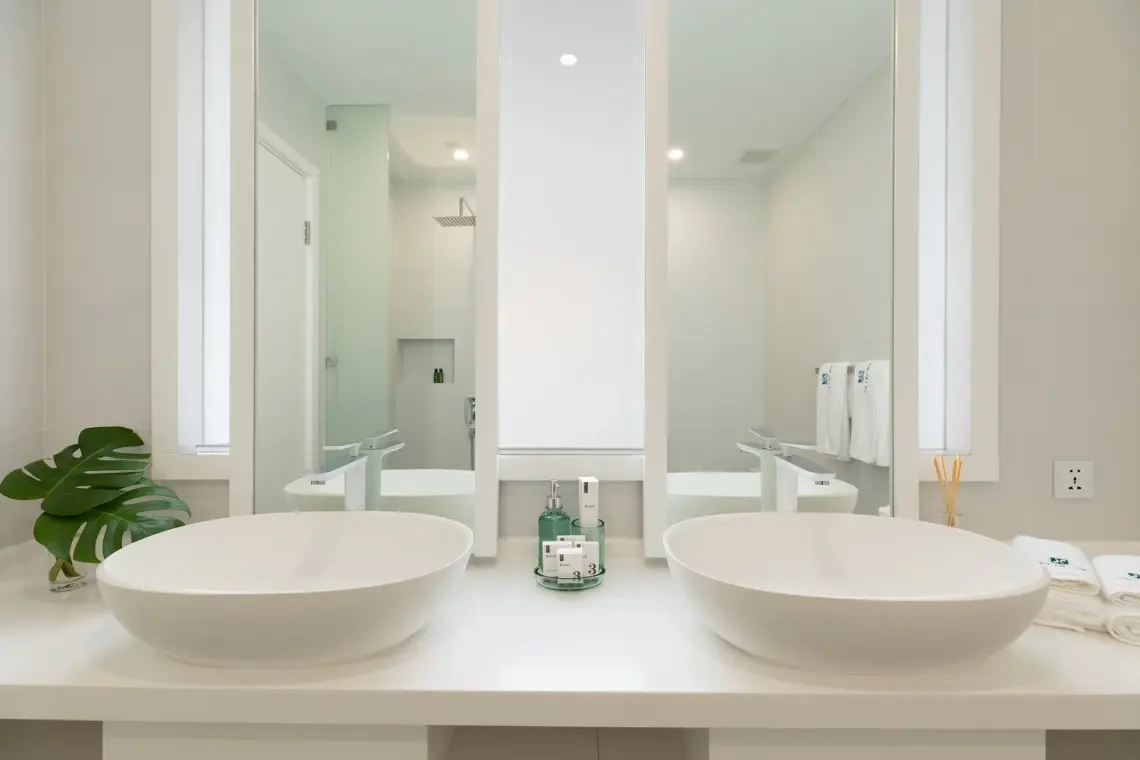 Bathroom with double basins and shower