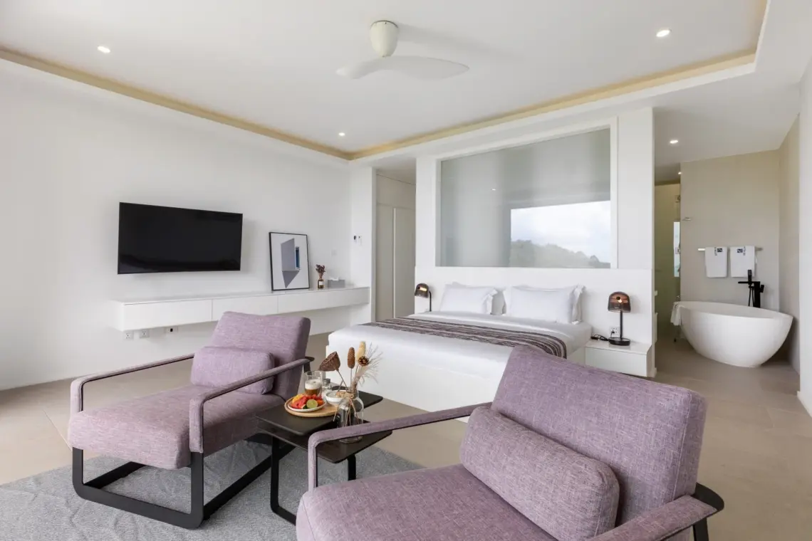 Bedroom seating area and open-plan bathroom