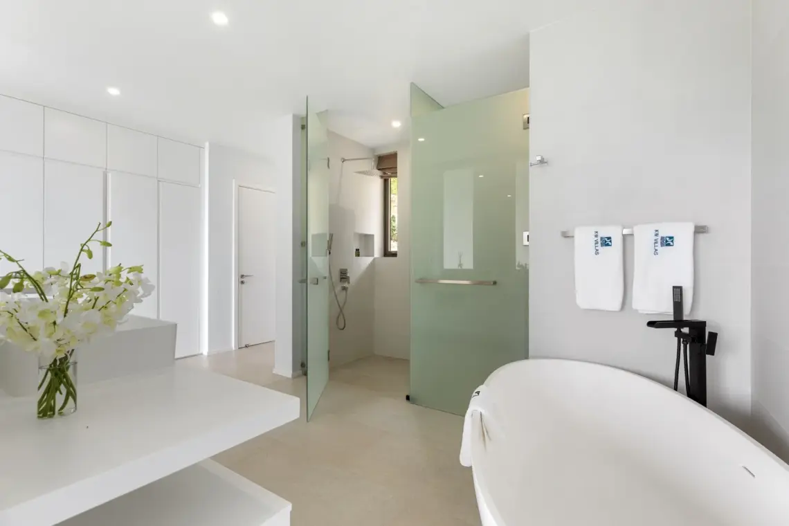 En-suite bathroom with bath and shower