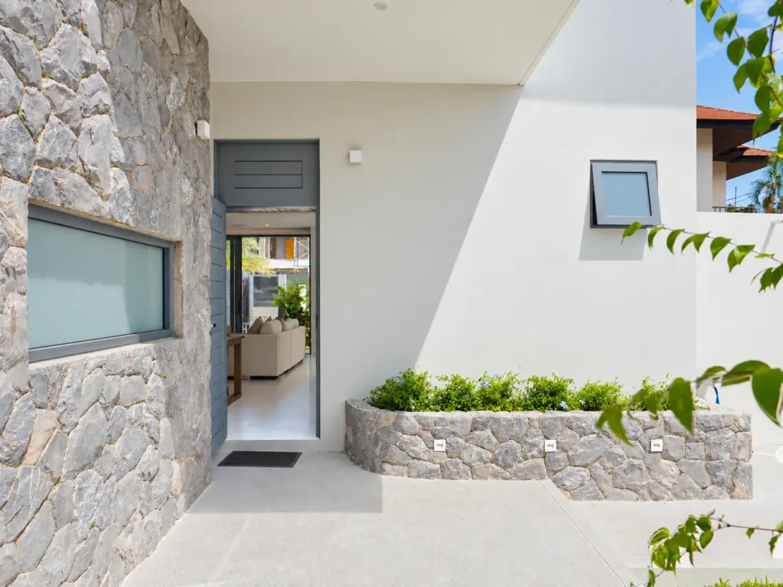 Entrance stonework at a completed showcase duplex villa in Bo Phut, Koh Samui