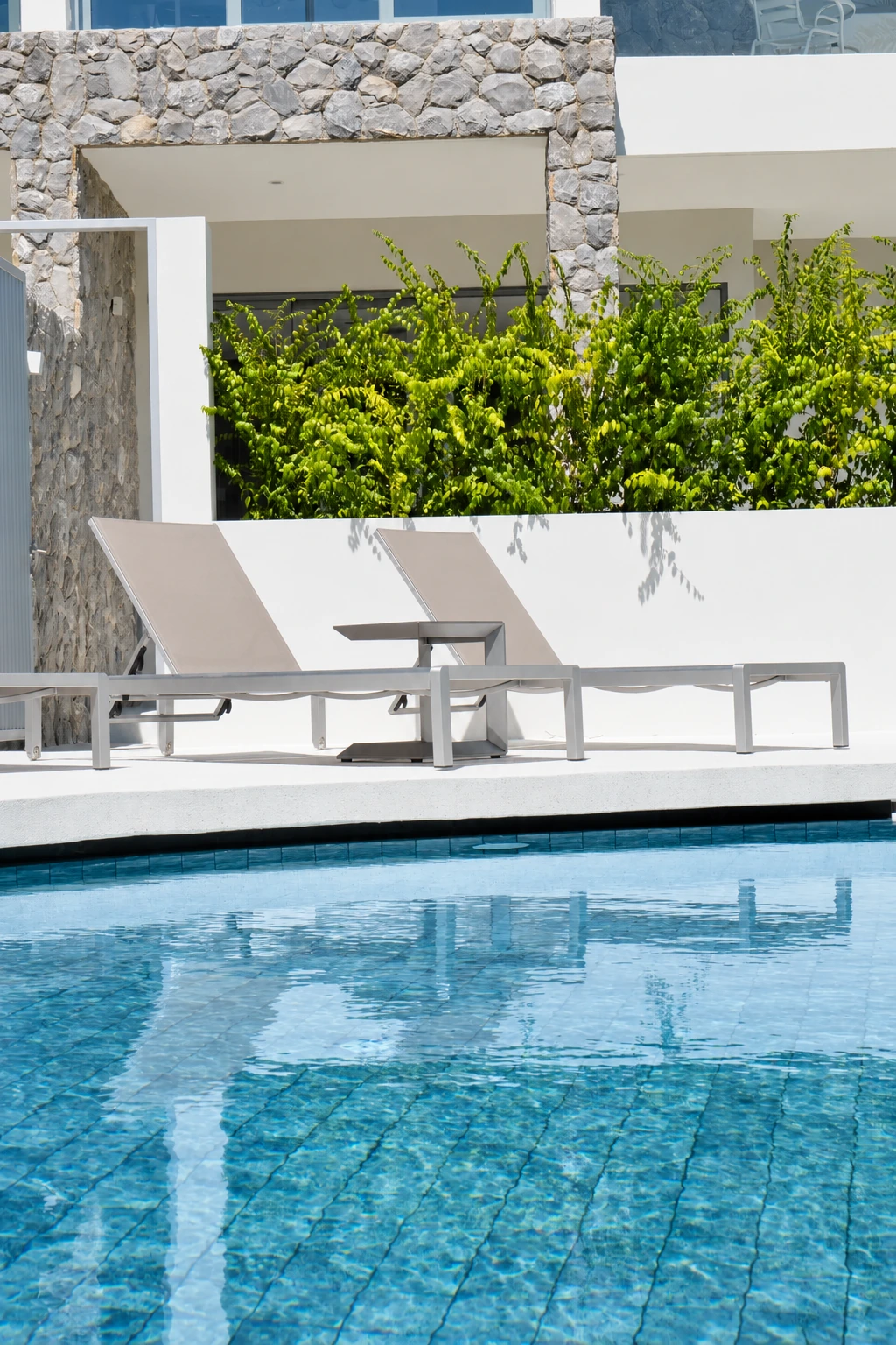 Pool sunloungers at a completed showcase duplex villa in Bo Phut, Koh Samui