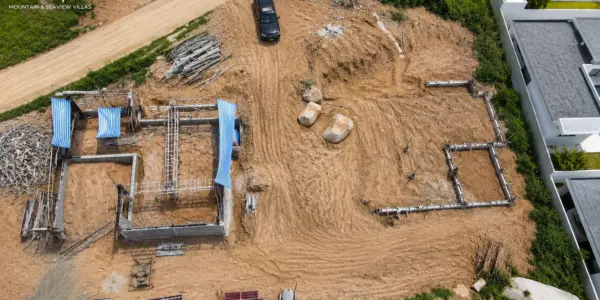 Eden Rise villa construction update labelled July 1st, showing an aerial site overview.